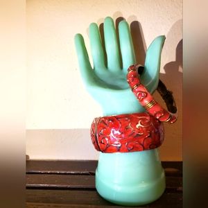 2 Red enamel 1980s cuff bracelets with hinges.